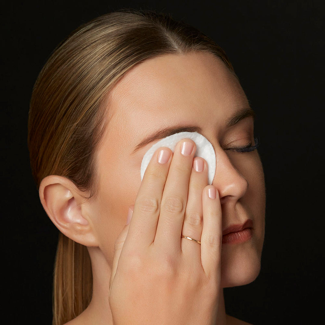 Image of model using cotton pad with micellar water lash wash