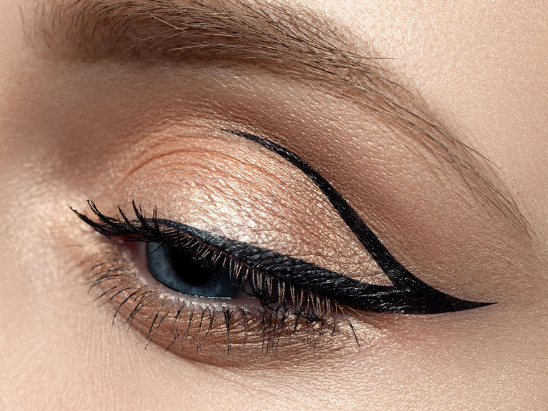 Close up image of eye with graphic shaped eyeliner